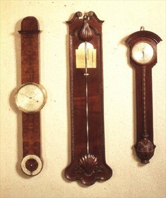 Three barometers: left: mahogany, Chippendale style; centre: Chippendale with shell motif; right: burr yew, by John Halifax of Barnsley, 1720 by English School